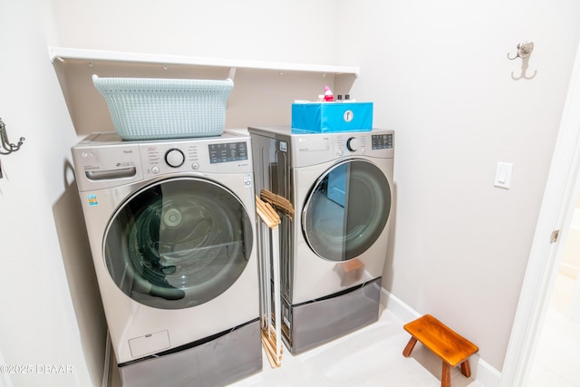 76 Longridge Ln, Ormond Beach, FL 32174 - washroom with washing machine and clothes dryer and baseboards