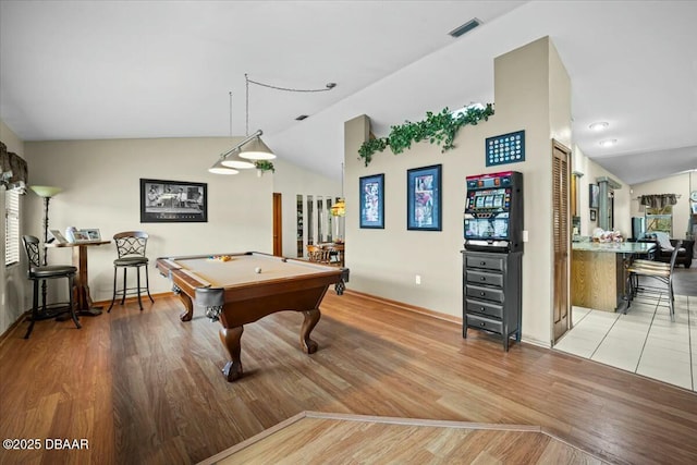 game room with light wood-style flooring, visible vents, vaulted ceiling, and pool table