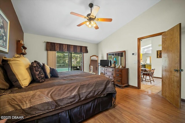 bedroom with baseboards, light wood-style flooring, ceiling fan, access to exterior, and vaulted ceiling