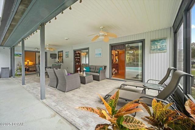 view of patio / terrace with ceiling fan and an outdoor hangout area