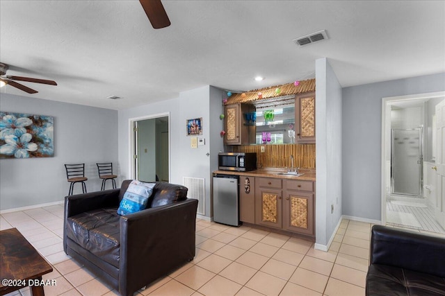4772 S Atlantic Ave, Ponce Inlet, FL 32127 - kitchen with sink, ceiling fan, light tile patterned flooring, backsplash, and appliances with stainless steel finishes