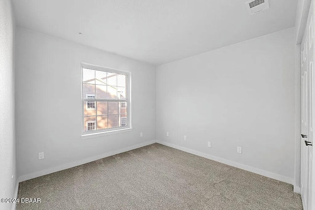 spare room featuring carpet floors