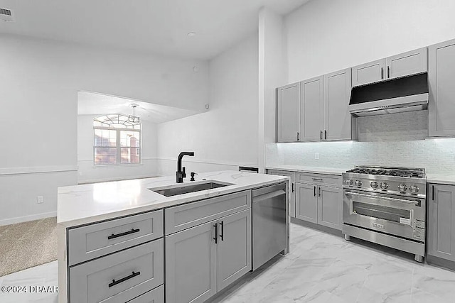 kitchen with gray cabinets, sink, stainless steel appliances, and high vaulted ceiling