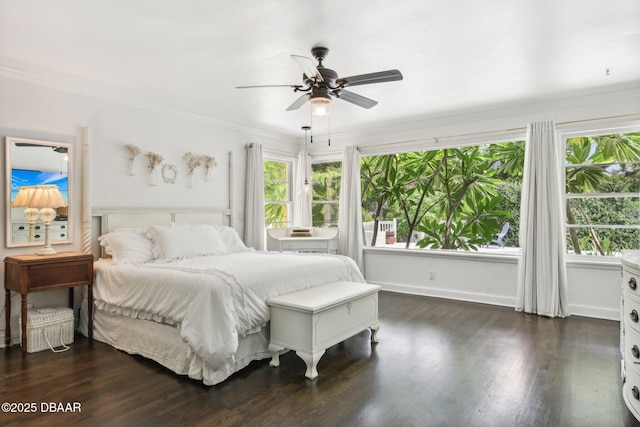 bedroom featuring baseboards, ceiling fan, ornamental molding, and dark wood-style flooring