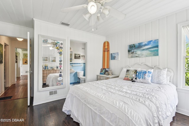 bedroom featuring dark wood finished floors, visible vents, and a ceiling fan