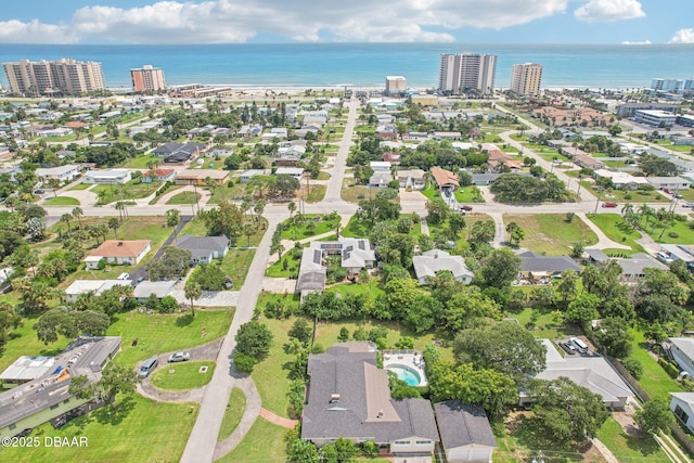 drone / aerial view with a water view and a city view