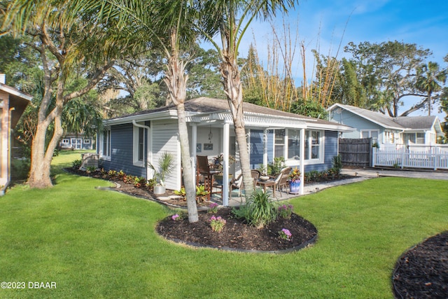 ranch-style home with a patio and a front yard