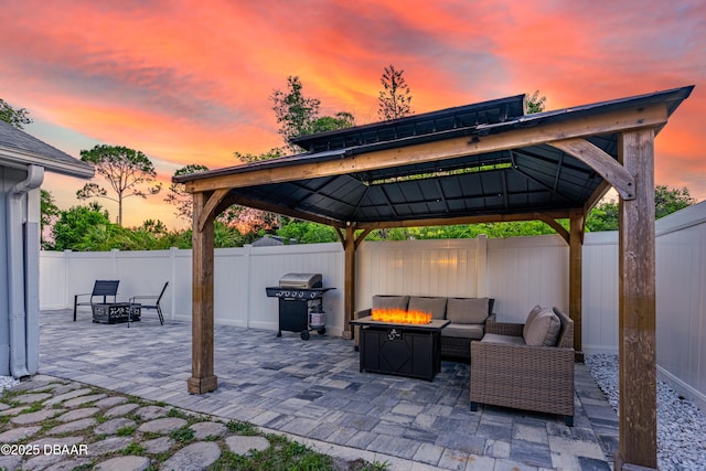 1197 Southfork Ct, Port Orange, FL 32129 - fenced backyard featuring a gazebo, a grill, a patio, and an outdoor living space with a fire pit