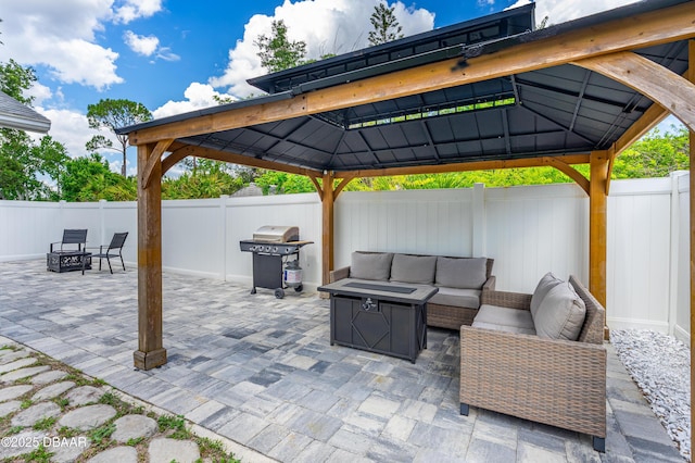 1197 Southfork Ct, Port Orange, FL 32129 - fenced backyard featuring a gazebo, area for grilling, an outdoor living space with a fire pit, and a patio area
