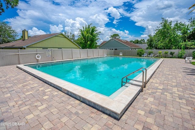 1197 Southfork Ct, Port Orange, FL 32129 - community pool featuring a fenced backyard and a patio area