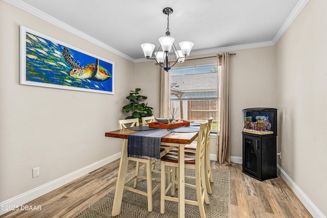 1197 Southfork Ct, Port Orange, FL 32129 - dining area with light wood finished floors, a chandelier, and crown molding