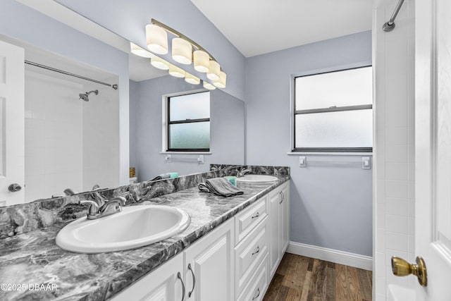 1197 Southfork Ct, Port Orange, FL 32129 - bathroom with double vanity, wood finished floors, and  shower combination
