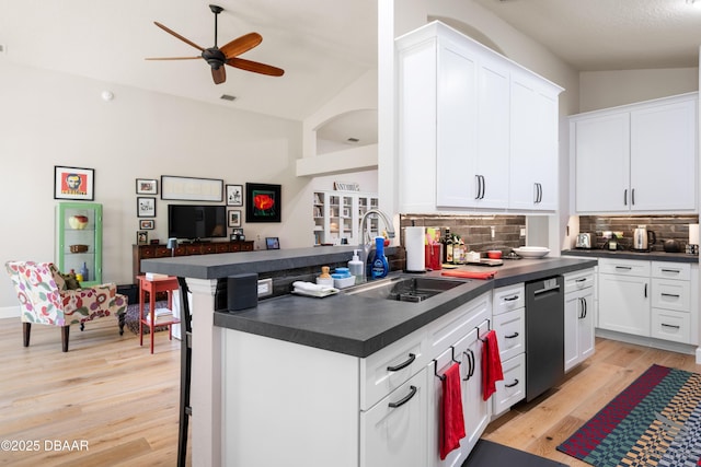 3349 Glenshane Way, Ormond Beach, FL 32174 - kitchen with dark countertops, a sink, ceiling fan, tasteful backsplash, and vaulted ceiling