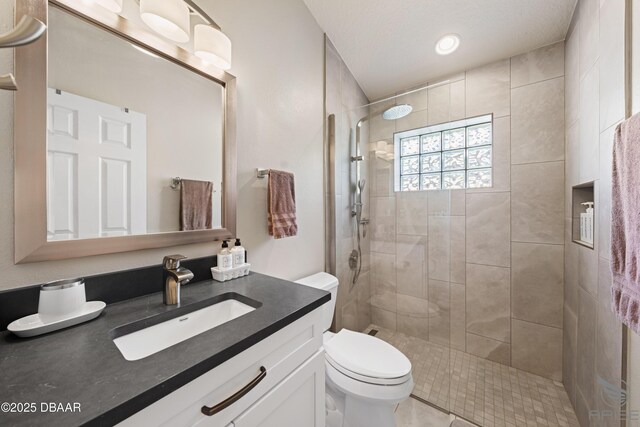 3349 Glenshane Way, Ormond Beach, FL 32174 - full bath featuring vanity, toilet, a tile shower, and tile patterned flooring