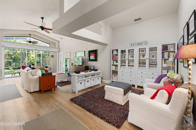 3349 Glenshane Way, Ormond Beach, FL 32174 - living room featuring high vaulted ceiling, wood finished floors, and a ceiling fan