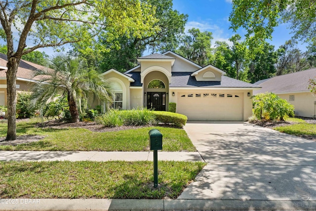3349 Glenshane Way, Ormond Beach, FL 32174 - view of front of property featuring a garage, concrete driveway, stucco siding, and roof with shingles