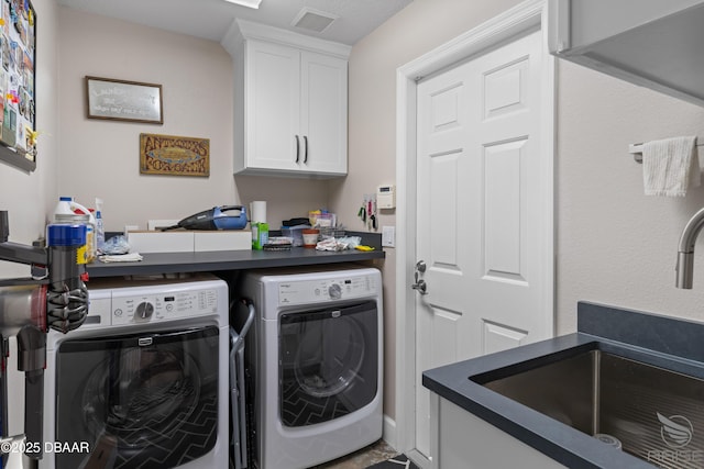 3349 Glenshane Way, Ormond Beach, FL 32174 - washroom featuring washing machine and dryer and cabinet space
