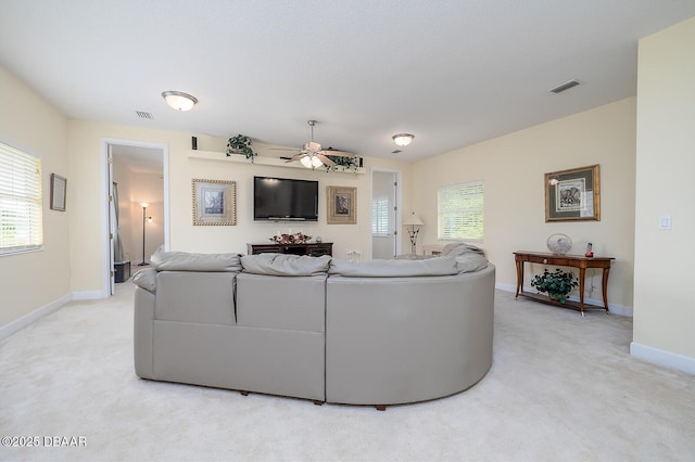 1491 Hohe Ln, Ormond Beach, FL 32174 - living room featuring light colored carpet, ceiling fan, and plenty of natural light