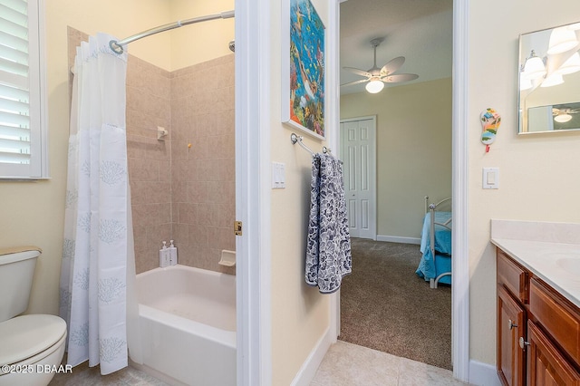 1491 Hohe Ln, Ormond Beach, FL 32174 - bathroom featuring vanity, toilet, shower / bath combination with curtain, ceiling fan, and baseboards
