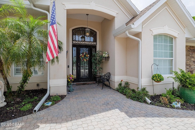 1491 Hohe Ln, Ormond Beach, FL 32174 - view of exterior entry featuring stucco siding