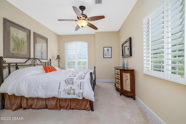 1491 Hohe Ln, Ormond Beach, FL 32174 - bedroom with light colored carpet, baseboards, and ceiling fan