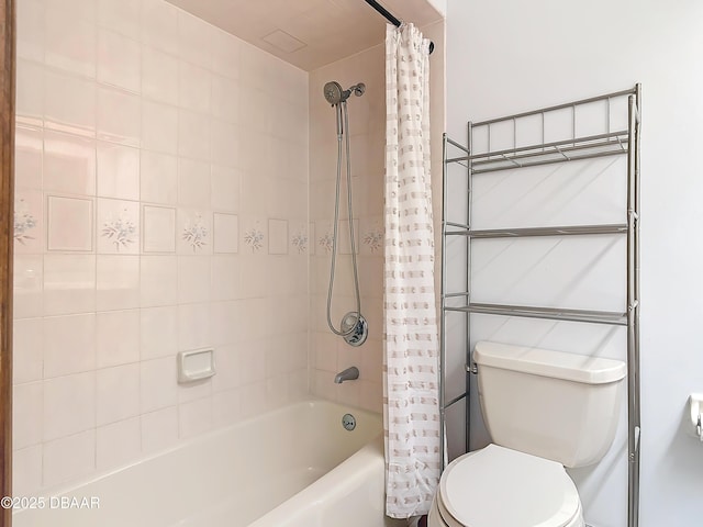 bathroom with shower / bath combination with curtain and toilet