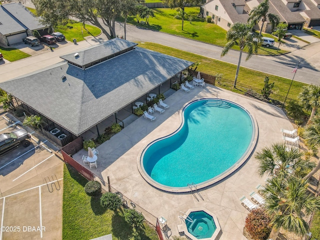 pool featuring a patio and fence