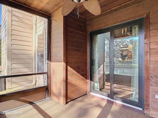 doorway to property featuring a ceiling fan