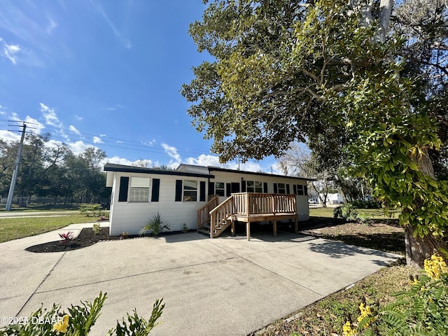 view of front of home with a wooden deck