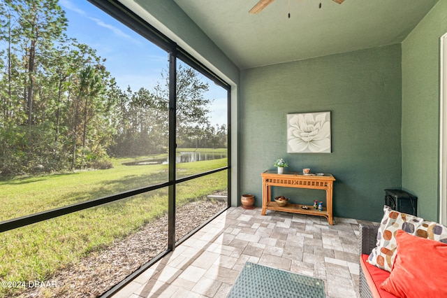 sunroom / solarium with ceiling fan