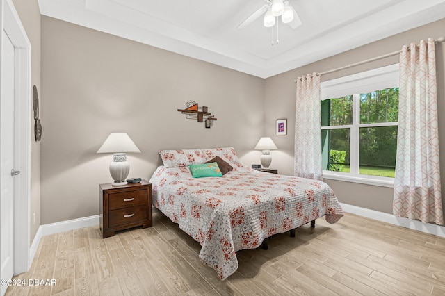 bedroom featuring light hardwood / wood-style floors and ceiling fan