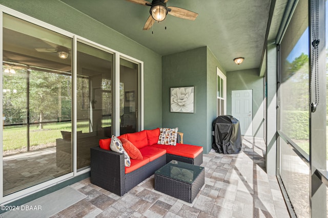 sunroom with ceiling fan