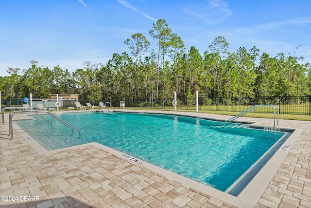 view of swimming pool featuring a patio