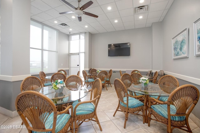 3043 S Atlantic Ave Unit 204, Daytona Beach Shores, FL 32118 - dining area with ceiling fan and light tile patterned flooring
