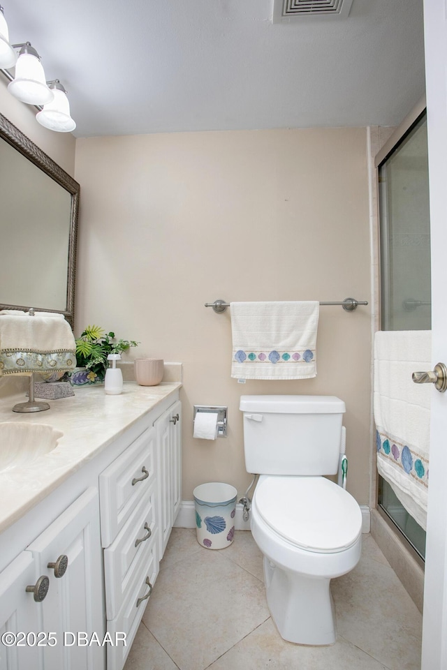 3043 S Atlantic Ave Unit 204, Daytona Beach Shores, FL 32118 - full bath with vanity, a stall shower, toilet, and tile patterned flooring