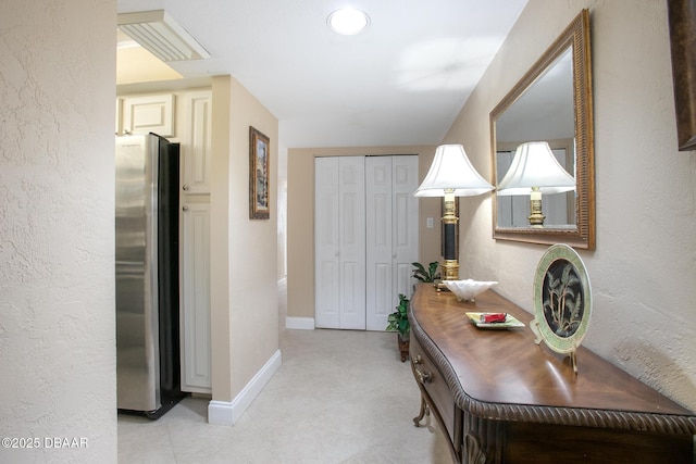 3043 S Atlantic Ave Unit 204, Daytona Beach Shores, FL 32118 - corridor featuring baseboards and a textured wall