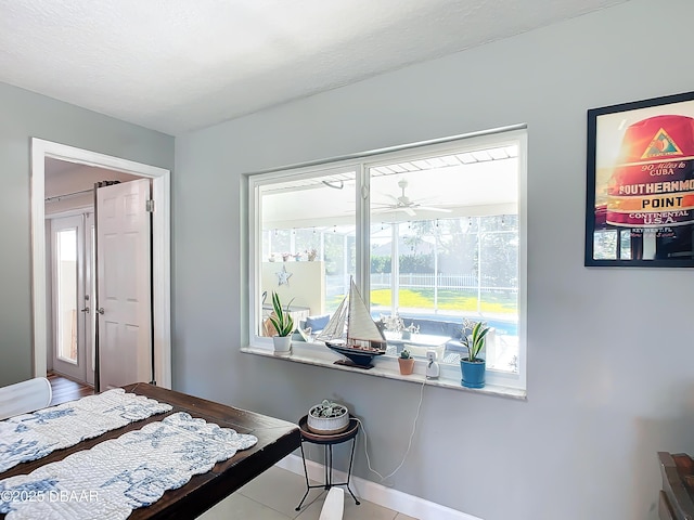 tiled bedroom featuring multiple windows