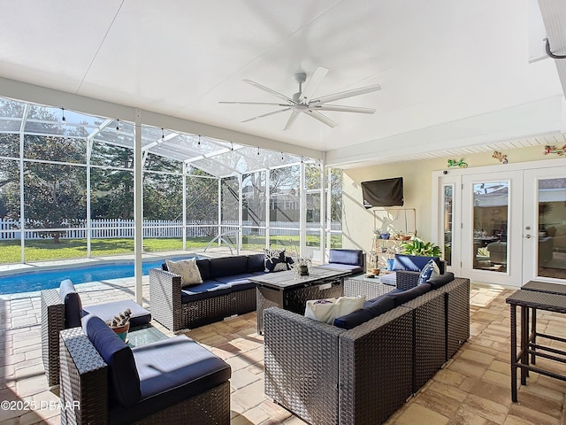 sunroom featuring ceiling fan