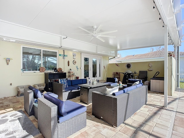 view of patio / terrace featuring ceiling fan, french doors, and outdoor lounge area