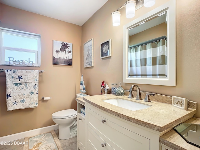 bathroom with toilet, tile patterned flooring, and vanity