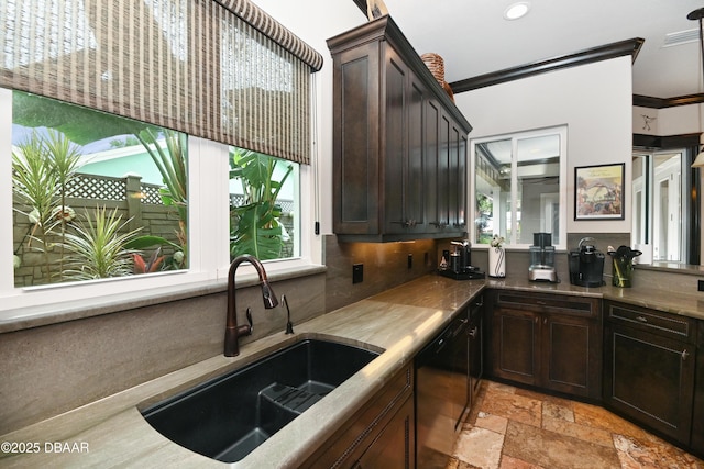 kitchen featuring dishwasher, crown molding, dark brown cabinets, and sink