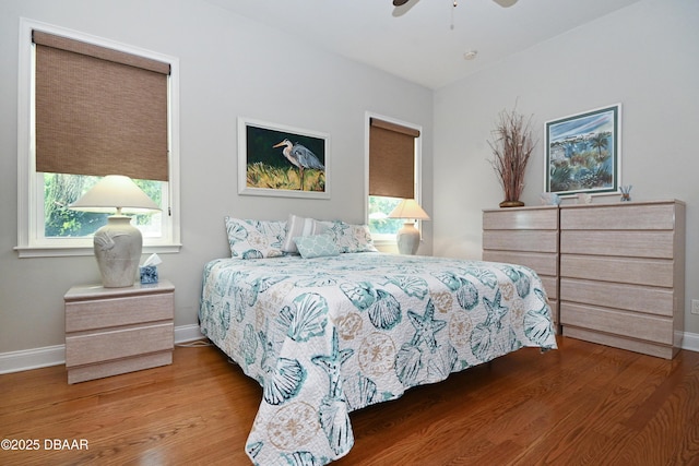 bedroom with ceiling fan and hardwood / wood-style floors