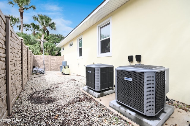 exterior space with a patio and central AC