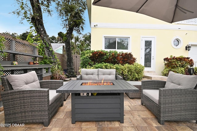 view of patio / terrace featuring an outdoor living space with a fire pit