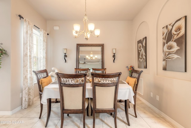 3418 Leonardo Ln, New Smyrna Beach, FL 32168 - dining space with a chandelier and tile patterned floors