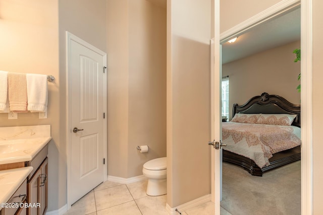 3418 Leonardo Ln, New Smyrna Beach, FL 32168 - bathroom with vanity, ensuite bath, and tile patterned flooring