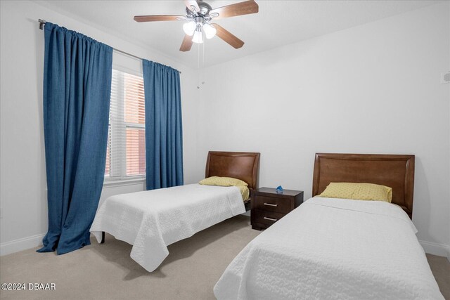 bedroom featuring ceiling fan and carpet flooring