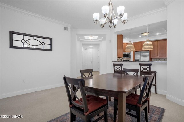 dining space with a notable chandelier, light carpet, and crown molding