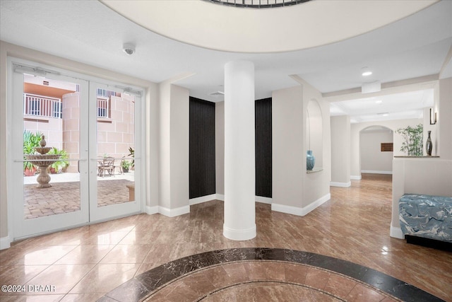 tiled foyer entrance featuring french doors