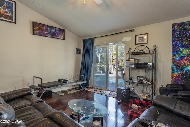 living room featuring hardwood / wood-style floors, ceiling fan, a textured ceiling, and vaulted ceiling